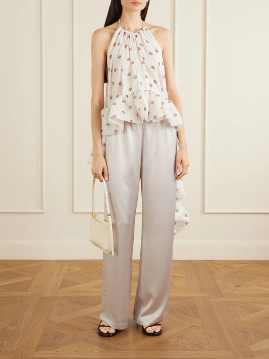 Image of a model wearing Tops. Product name - Tamara Silk-chiffon Peplum Blouse in White colour by brand - LIBEROWE