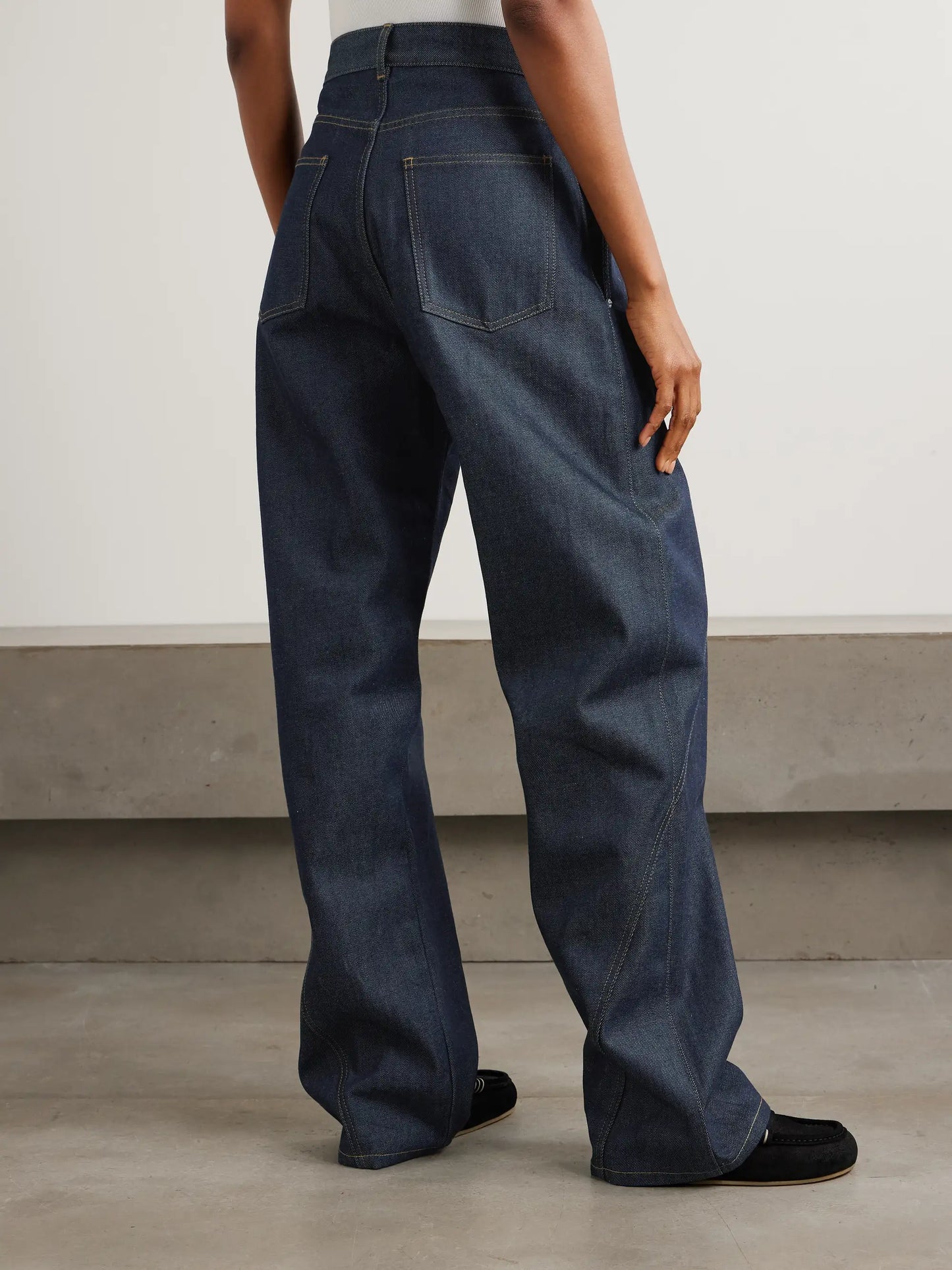 Twisted Asymmetric Embroidered High-rise Jeans