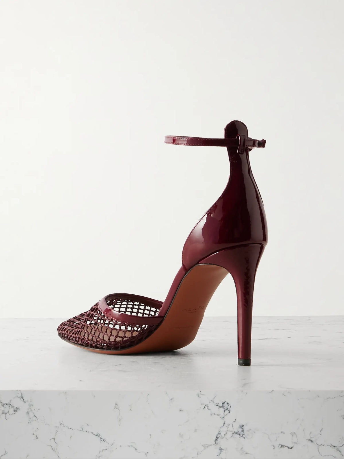 90 Fishnet And Patent-leather Pumps
