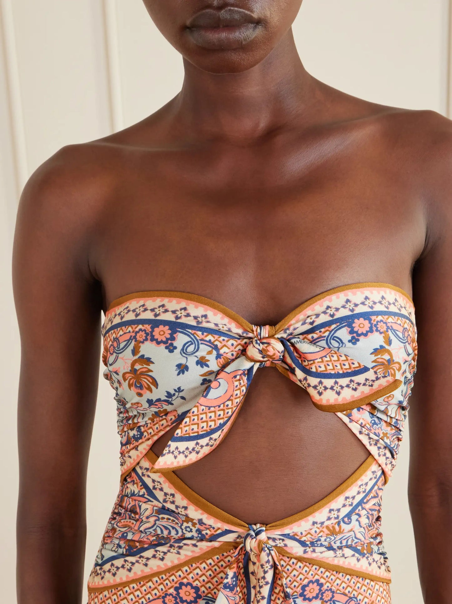 Aster Strapless Knot-detailed Cut-out Printed Swimsuit