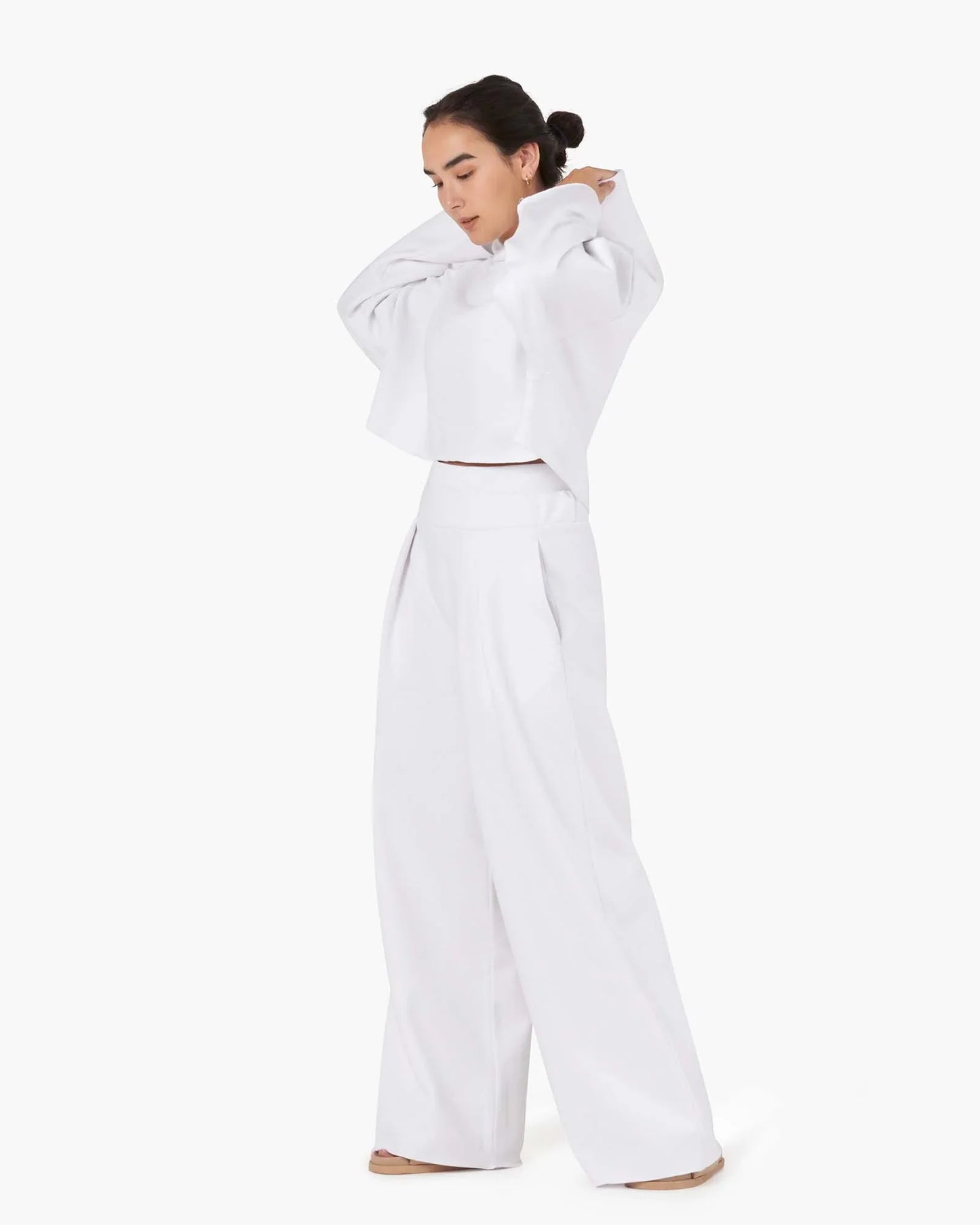 Image of a model wearing Outerwear. Productname: Core Fleece Cropped Hoodie White in White colour by brand - TKEES