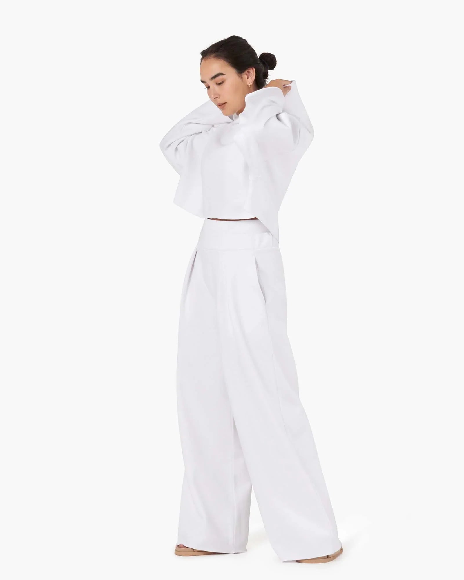 Image of a model wearing Outerwear. Productname: Core Fleece Cropped Hoodie White in White colour by brand - TKEES