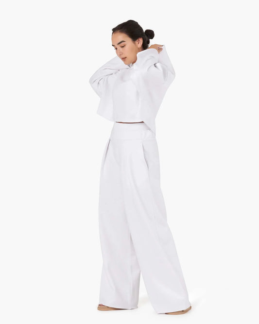Image of a model wearing Outerwear. Productname: Core Fleece Cropped Hoodie White in White colour by brand - TKEES