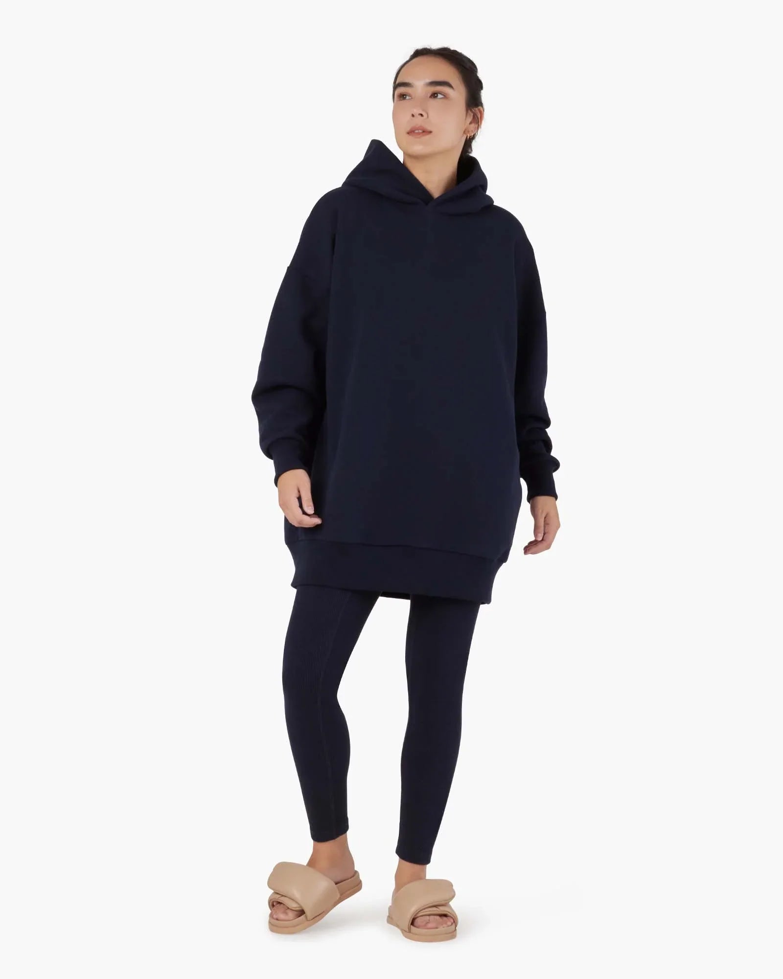 Image of a model wearing Outerwear. Productname: Core Fleece Oversized Hoodie Midnight Navy in Midnight Navy colour by brand - TKEES