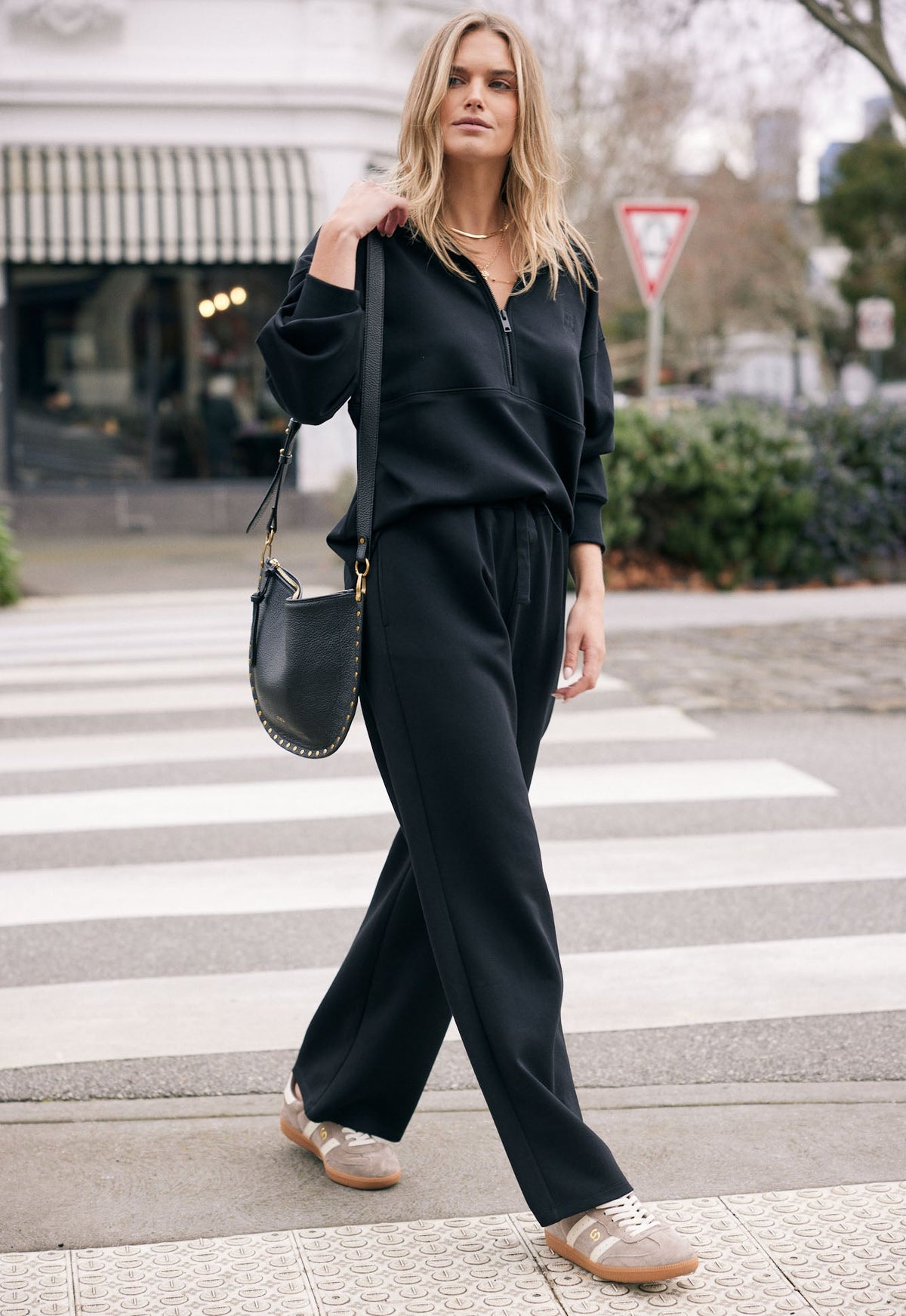 Image of a model wearing Pants. Product name - Escape Super Soft Lounge Pant Black in Black colour by brand - White & Co.