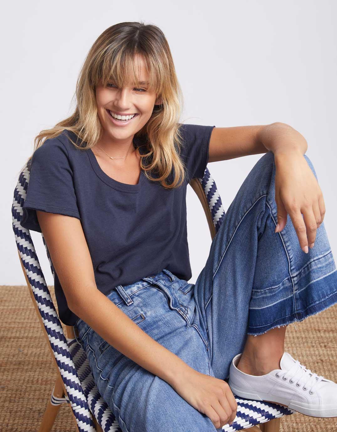 Image of a model wearing Tops. Productname: Original Round Neck T-Shirt - in Navy colour by brand - White & Co.