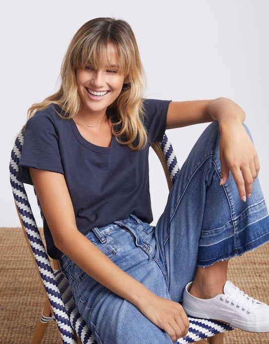 Image of a model wearing Tops. Productname: Original Round Neck T-Shirt - in Navy colour by brand - White & Co.