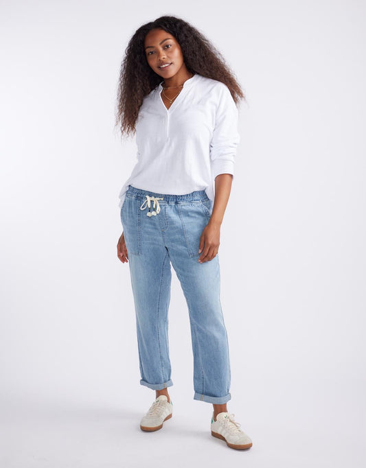 Image of a model wearing Pants. Productname: Beach Comber Pant - in Mid Wash colour by brand - White & Co.