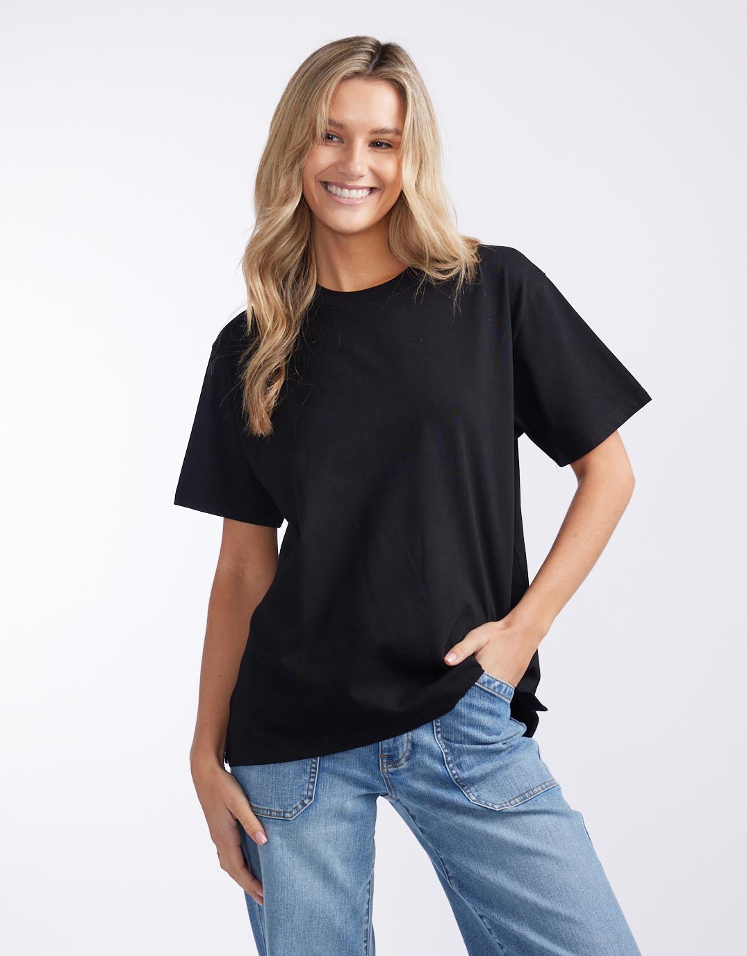 Image of a model wearing Tops. Productname: Boyfriend Tee - in Black colour by brand - White & Co.
