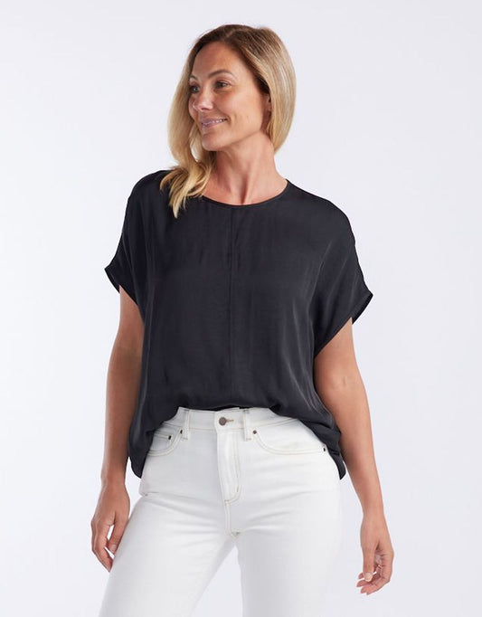 Image of a model wearing Tops. Productname: Effortless Camille Shell Top - in Black colour by brand - White & Co.