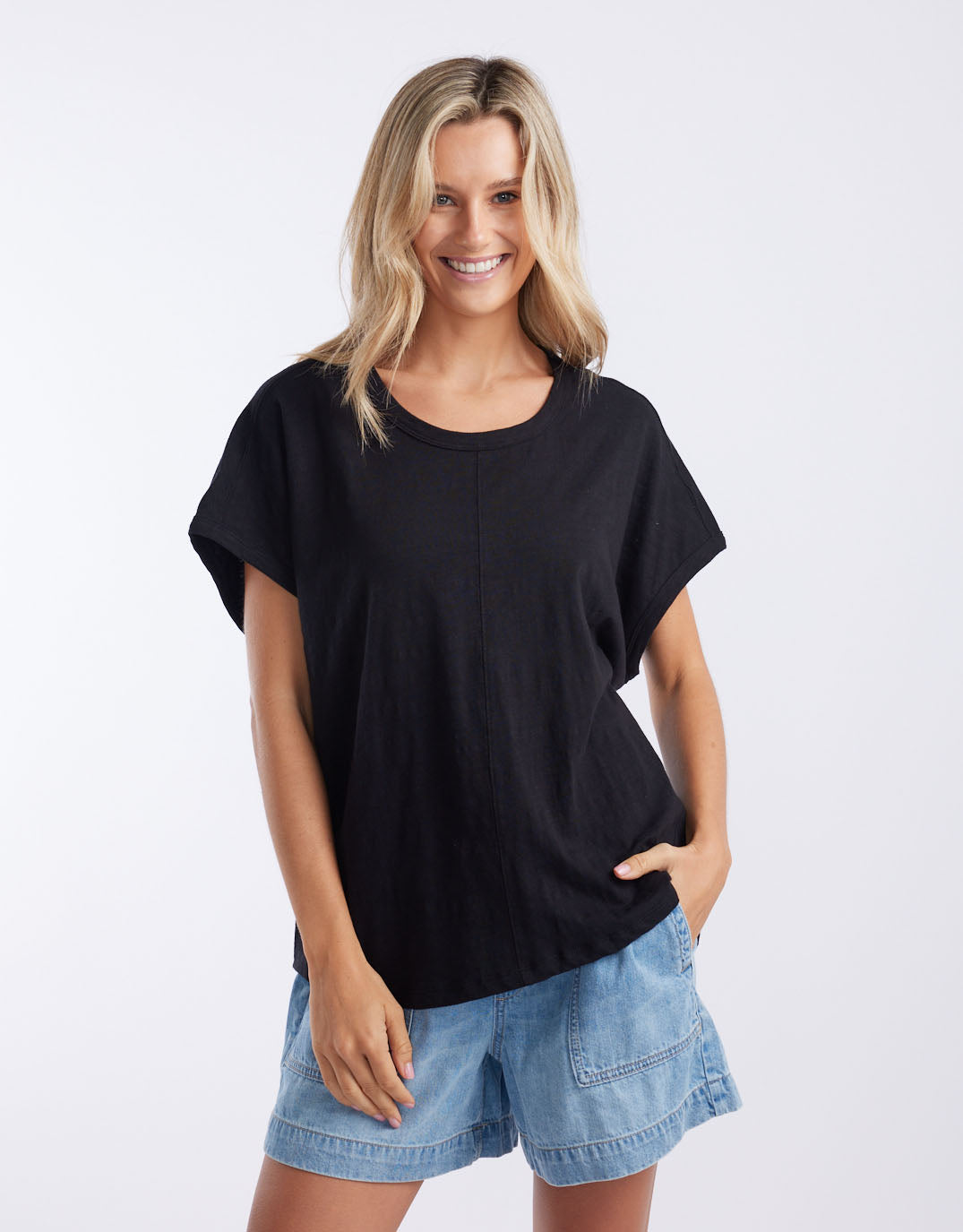 Image of a model wearing Tops. Productname: Camille Cotton Top - in Black colour by brand - White & Co.