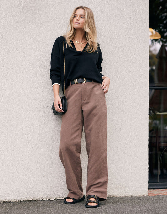 Image of a model wearing Pants. Product name - Chicago Linen Pant Chocolate in Chocolate colour by brand - White & Co.