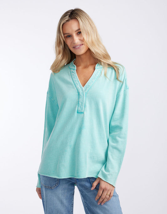 Image of a model wearing Tops. Productname: Henley Sunset Top - in Seaglass colour by brand - White & Co.