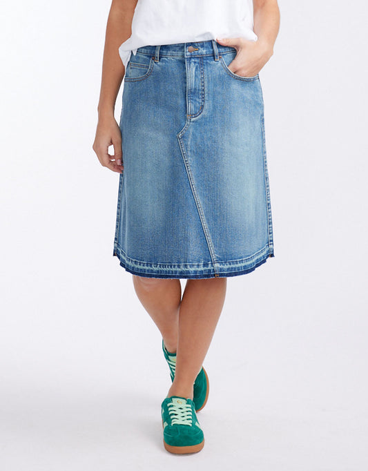 Image of a model wearing Skirts. Productname: Holly Denim Skirt - in Mid Wash colour by brand - White & Co.