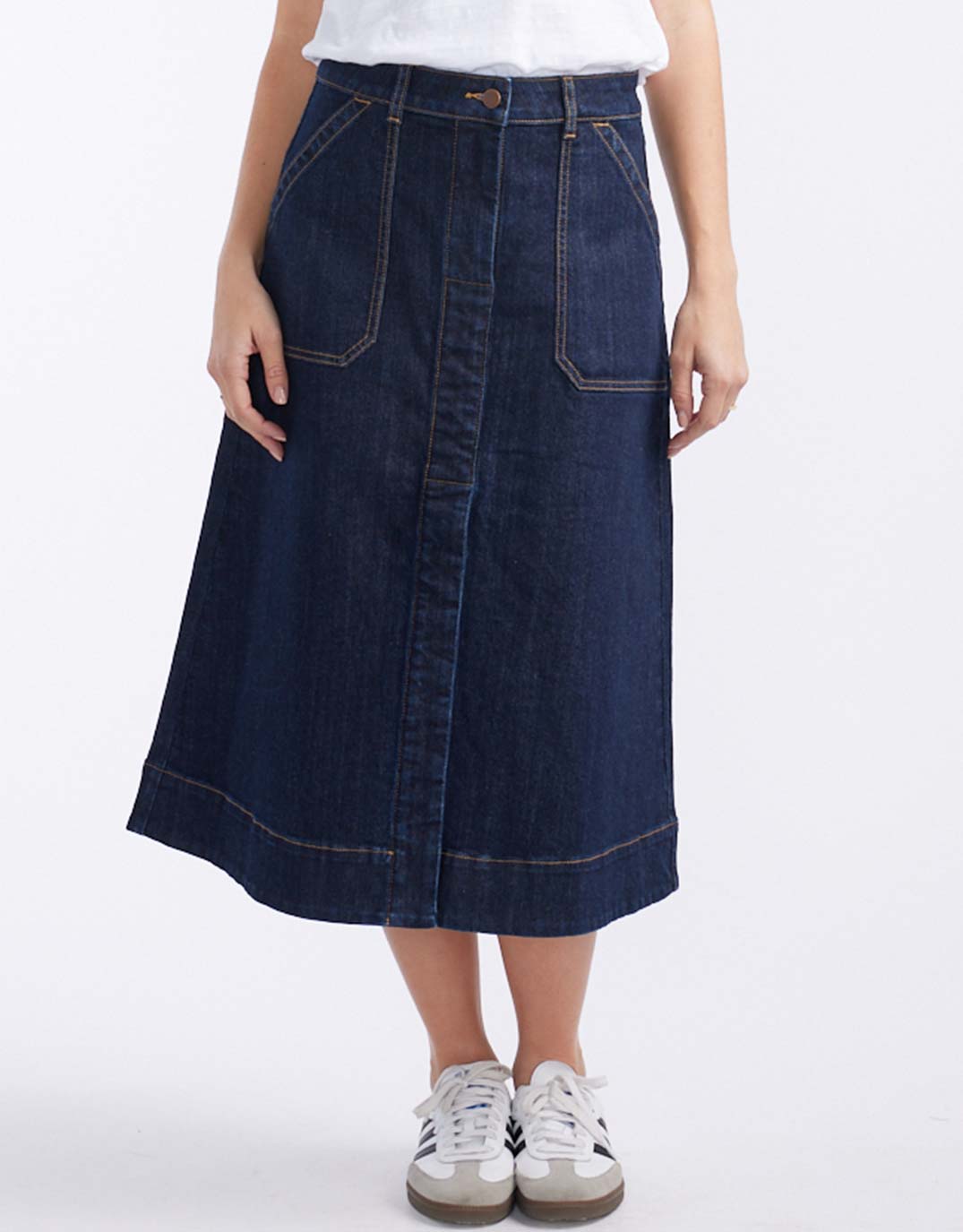 Image of a model wearing Skirts. Productname: Catalina Midi Skirt - in Indigo colour by brand - White & Co.