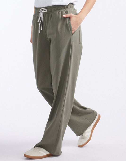 Image of a model wearing Pants. Productname: The Lounger Pant - in Khaki colour by brand - White & Co.