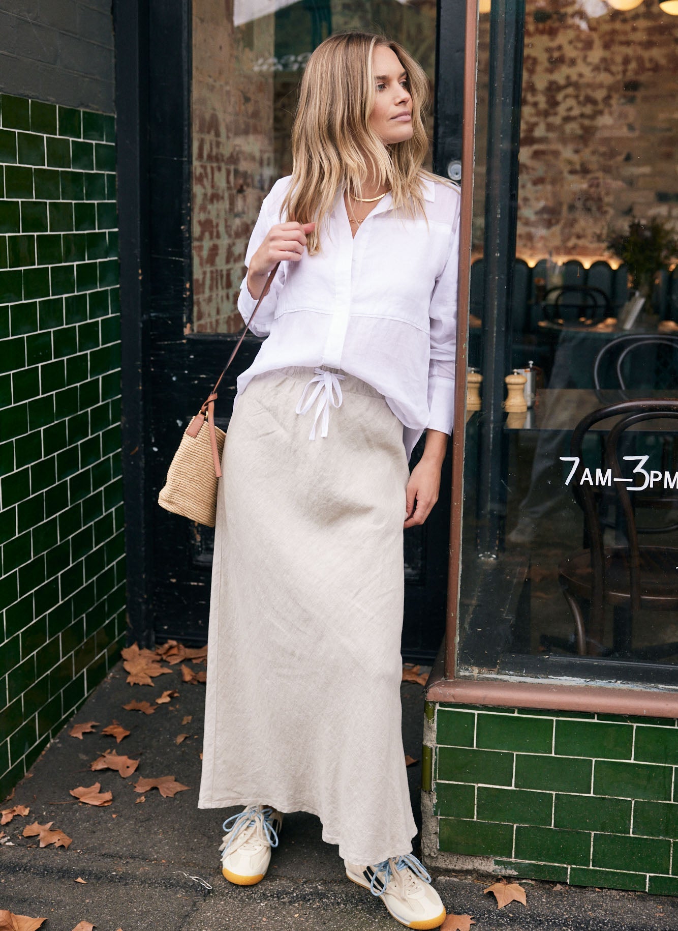 Image of a model wearing Skirts. Product name - Linen Slip Skirt Natural in Natural colour by brand - White & Co.