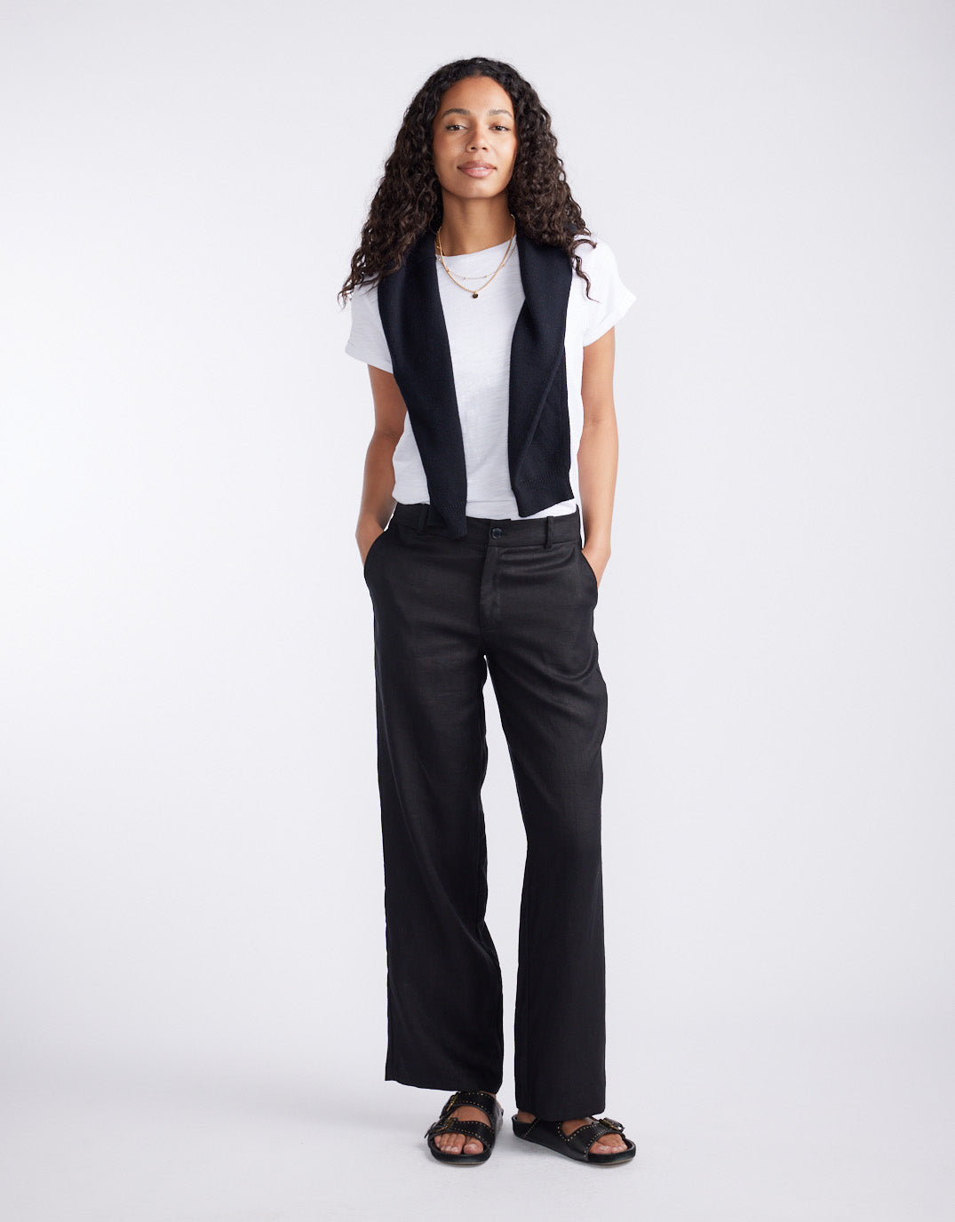 Image of a model wearing Pants. Product name - Linen Pant Black in Black colour by brand - White & Co.