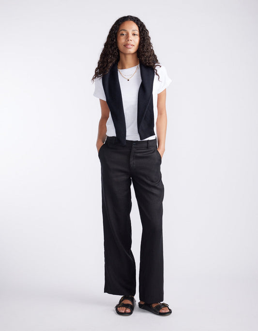 Image of a model wearing Pants. Product name - Chicago Linen Pant Black in Black colour by brand - White & Co.