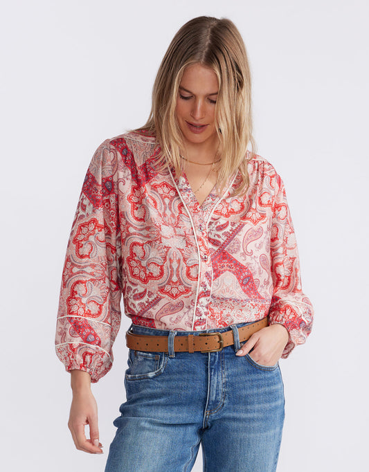 Image of a model wearing Tops. Product name - Mila Blouse Sunset Paisley in Sunset Paisley colour by brand - White & Co.