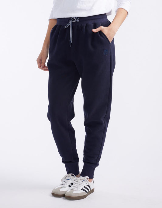 Image of a model wearing Pants. Productname: Monogram Fleece Lounge Pants - in Navy colour by brand - White & Co.