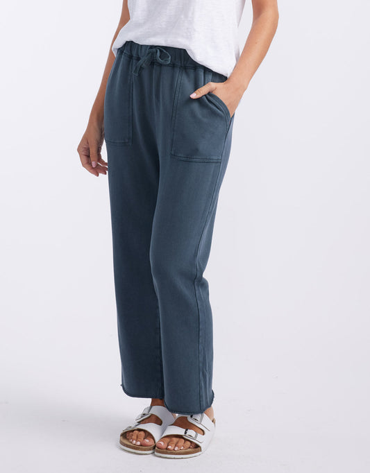 Image of a model wearing Pants. Product name - Raw Edge Lounge Pant Washed Navy in Washed Navy colour by brand - White & Co.
