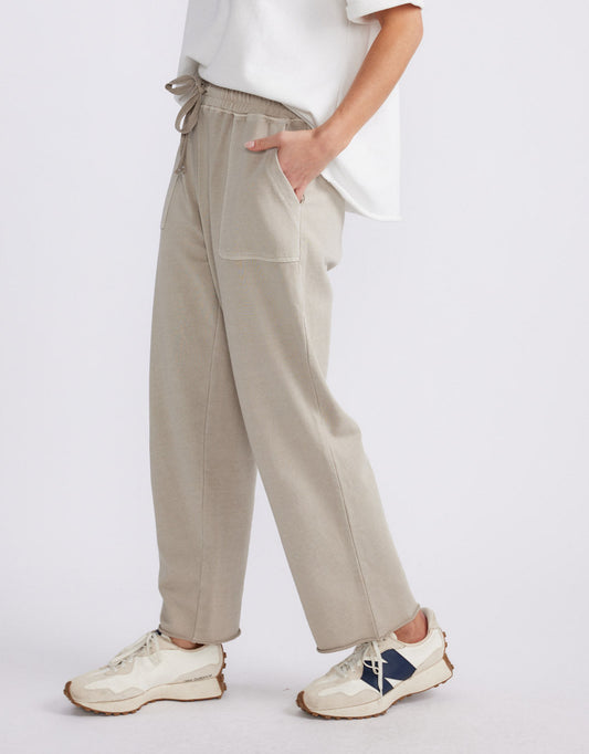 Image of a model wearing Pants. Product name - Raw Edge Lounge Pant Washed Stone in Washed Stone colour by brand - White & Co.