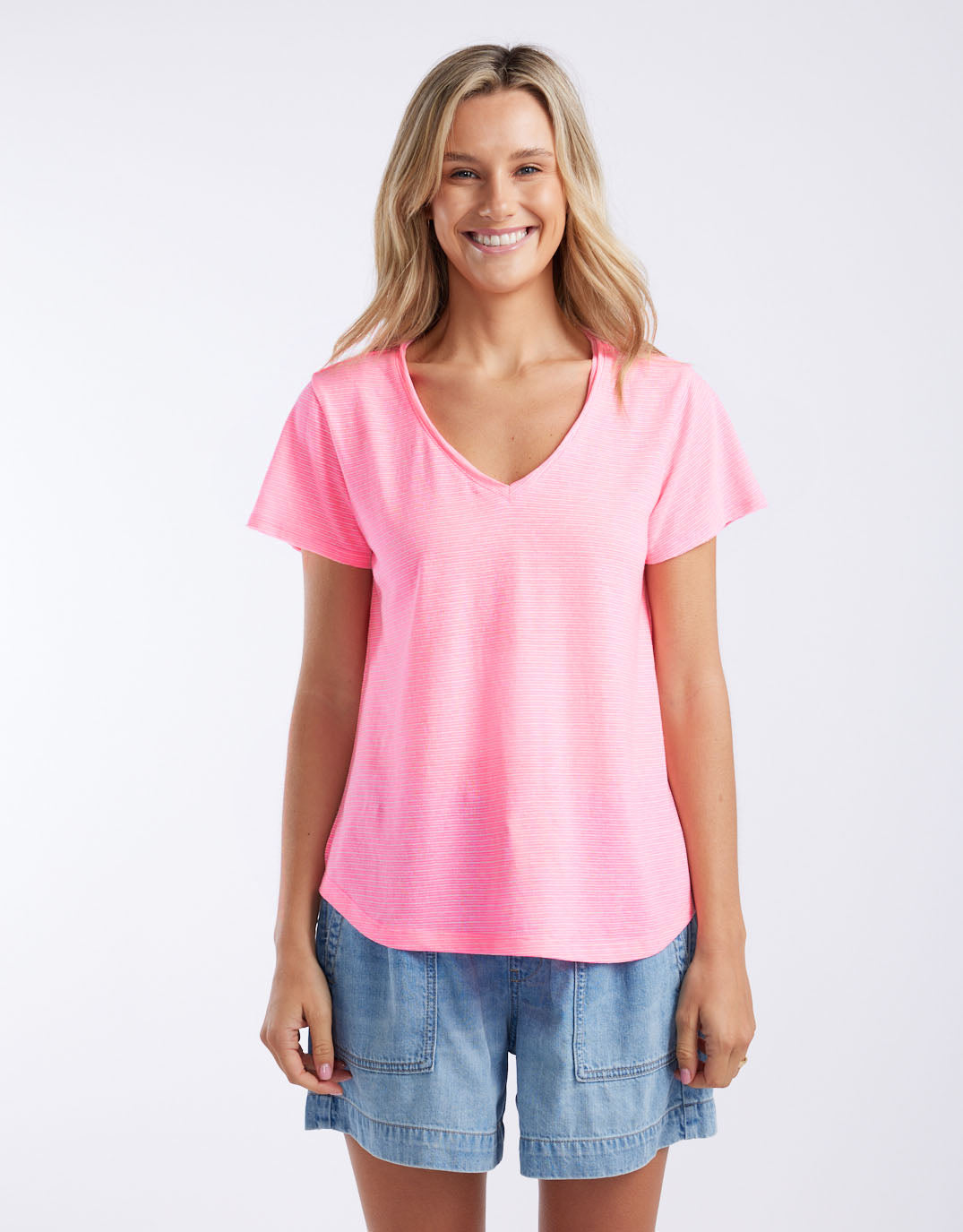 Image of a model wearing Tops. Productname: Sorbet Stripe Vee Neck Tee - in Neon Pink colour by brand - White & Co.