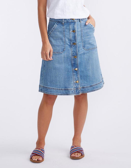 Image of a model wearing Skirts. Productname: Stevie Denim Skirt - in Mid Wash colour by brand - White & Co.