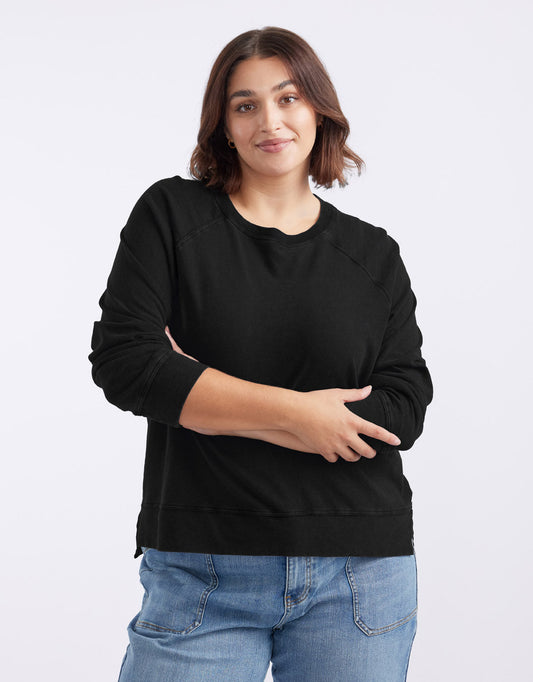 Image of a model wearing Tops. Productname: Sunset Throw On Top - in Black colour by brand - White & Co.