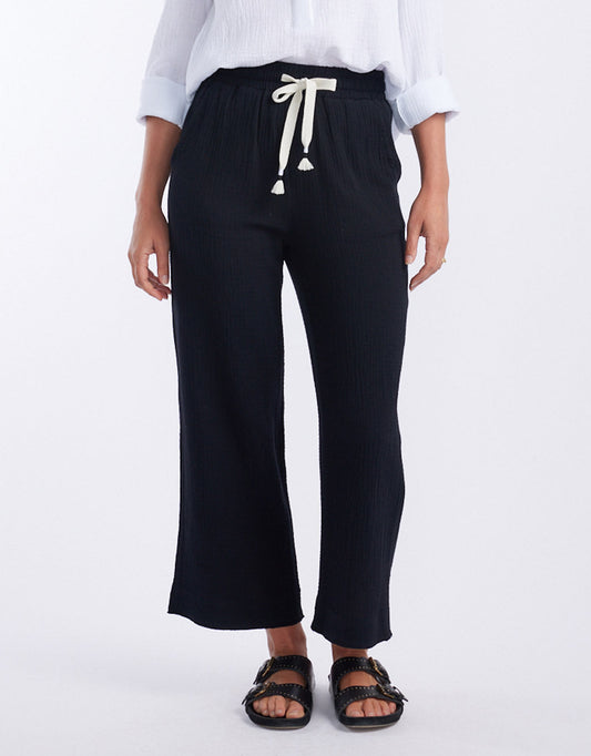 Image of a model wearing Pants. Productname: The Coastal Pant - in Black colour by brand - White & Co.
