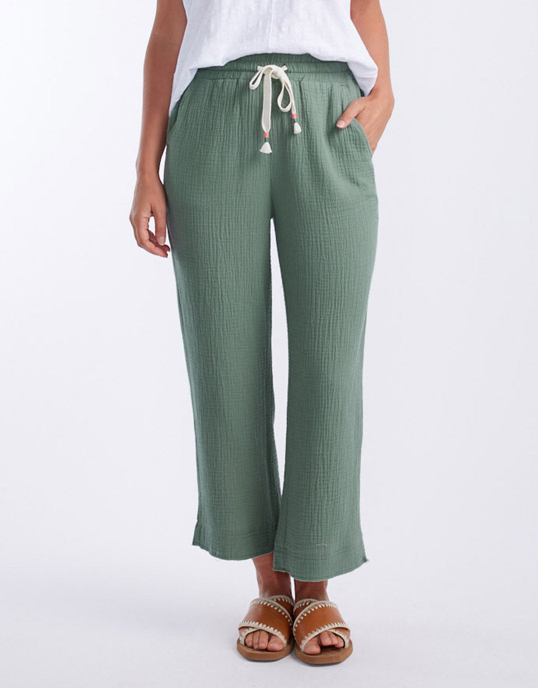 Image of a model wearing Pants. Productname: The Coastal Pant - in Sage colour by brand - White & Co.