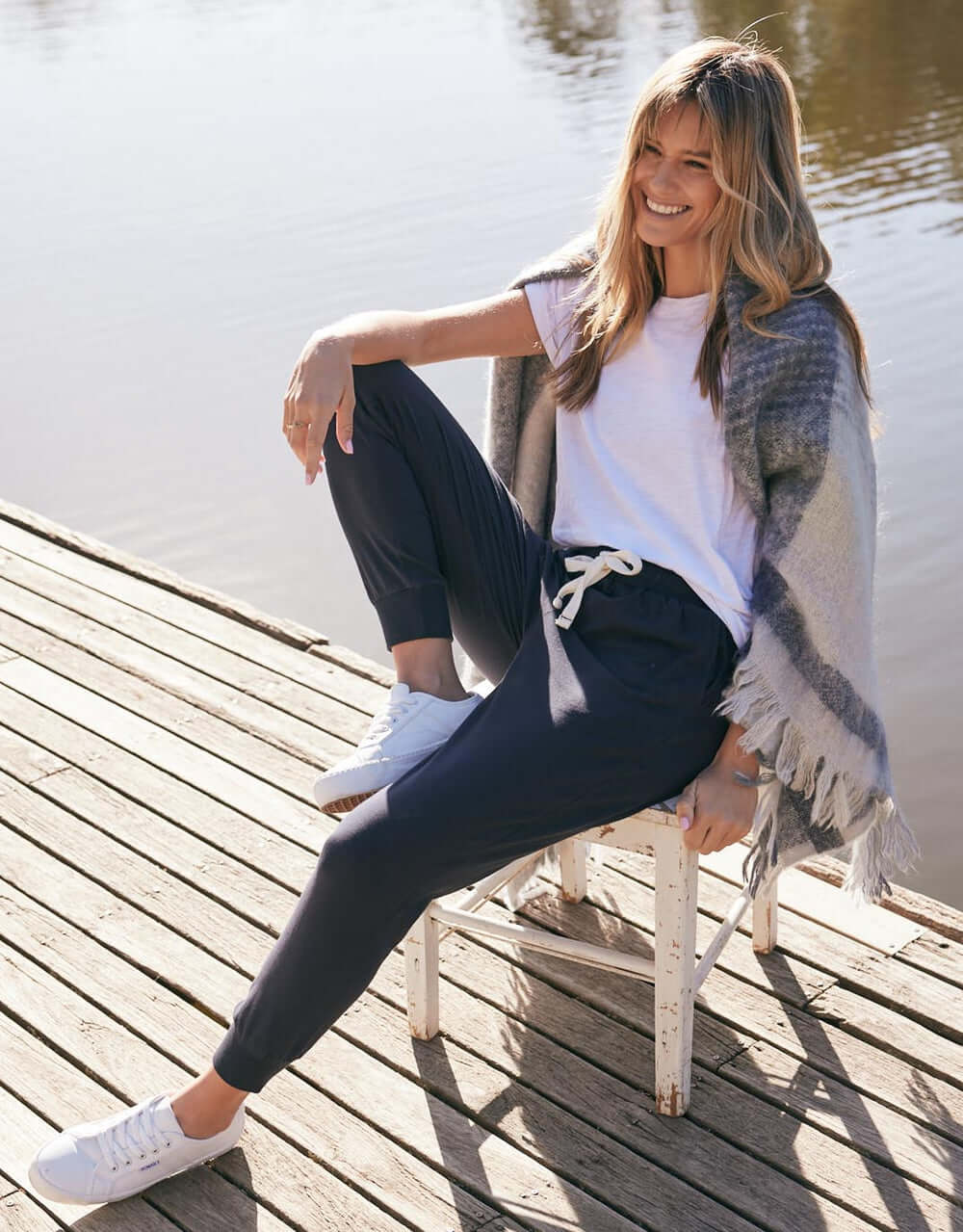 Image of a model wearing Pants. Productname: The Sunday Lounge Pant - in Navy colour by brand - White & Co.