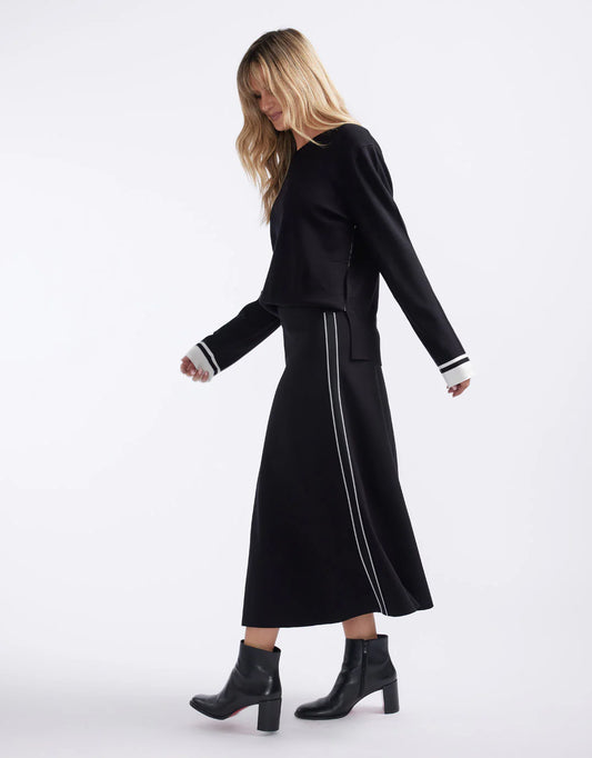 Image of a model wearing Skirts. Product name - Timeless Ponte Midi Skirt French Tape in French Tape colour by brand - White & Co.