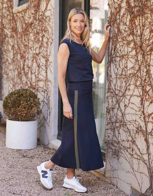 Image of a model wearing Skirts. Product name - Timeless Ponte Midi Skirt Navy/Khaki in Navy/Khaki colour by brand - White & Co.