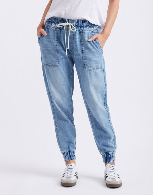 Image of a model wearing Pants. Productname: Weekend Utility Pants - in Mid Wash colour by brand - White & Co.