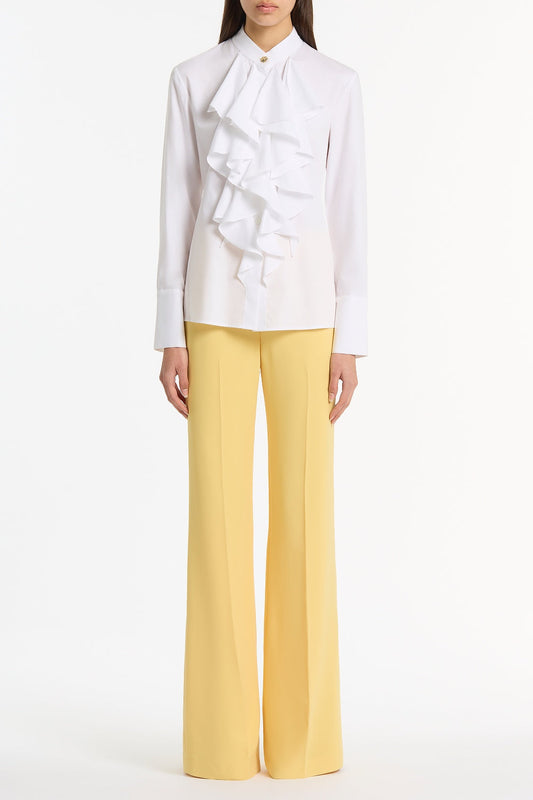 Image of a model wearing Tops. Product name - White Cotton Frill Front Shirt in White colour by brand - Carla Zampatti