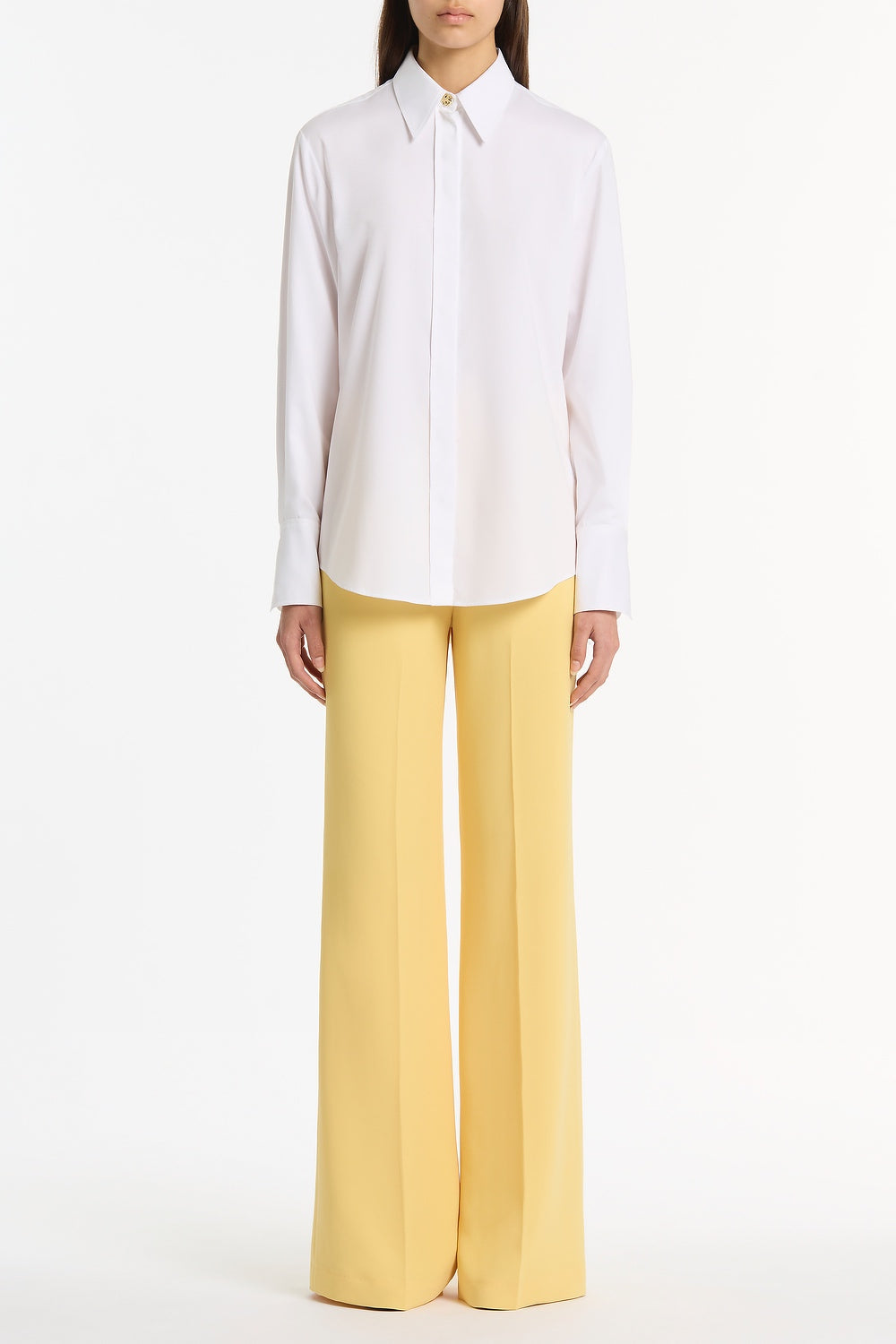 Image of a model wearing Tops. Product name - White Cotton Relaxed Shirt in White colour by brand - Carla Zampatti