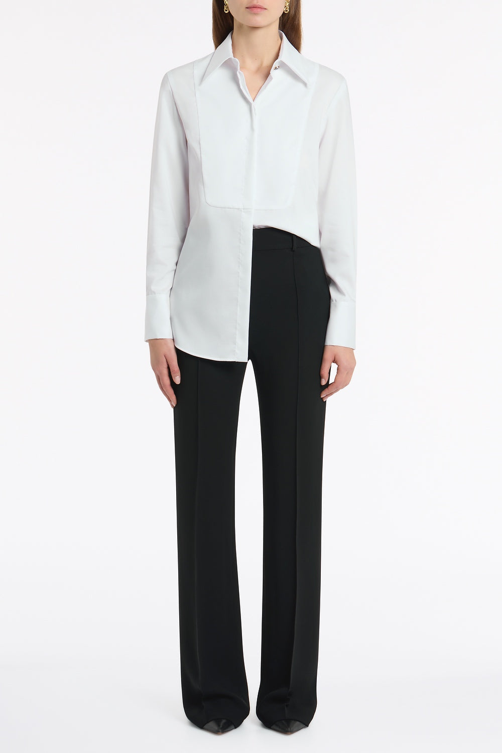 Image of a model wearing Tops. Product name - White Cotton Shirting Bib Front Shirt in White colour by brand - Carla Zampatti