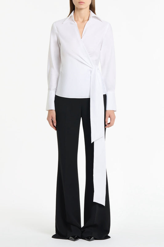Image of a model wearing Tops. Product name - White Cotton Wrap Top in White colour by brand - Carla Zampatti