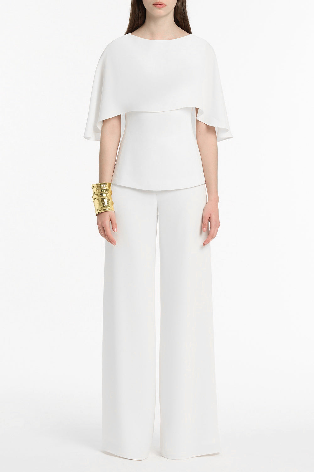 Image of a model wearing Tops. Product name - White Crepe Cape Top in White colour by brand - Carla Zampatti