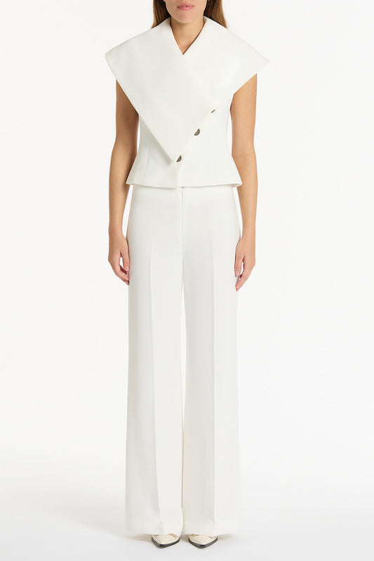 Image of a model wearing Pants. Product name - White Crepe Low Waist Pant in White colour by brand - Carla Zampatti
