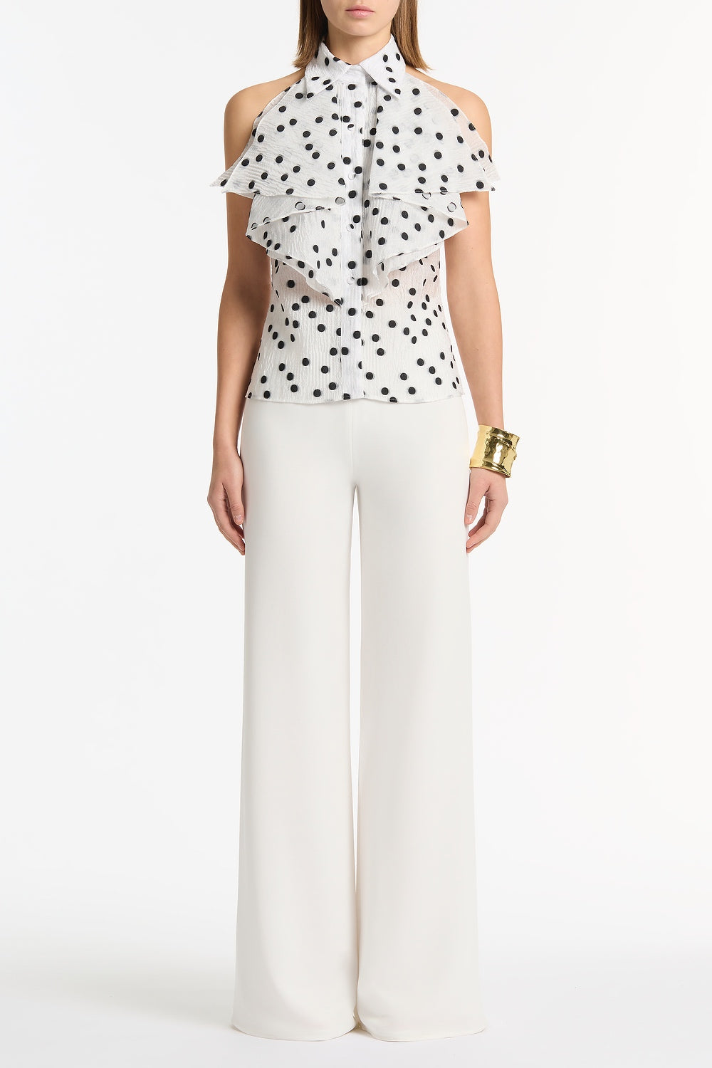 Image of a model wearing Pants. Product name - White Crepe Palazzo Pant in White colour by brand - Carla Zampatti
