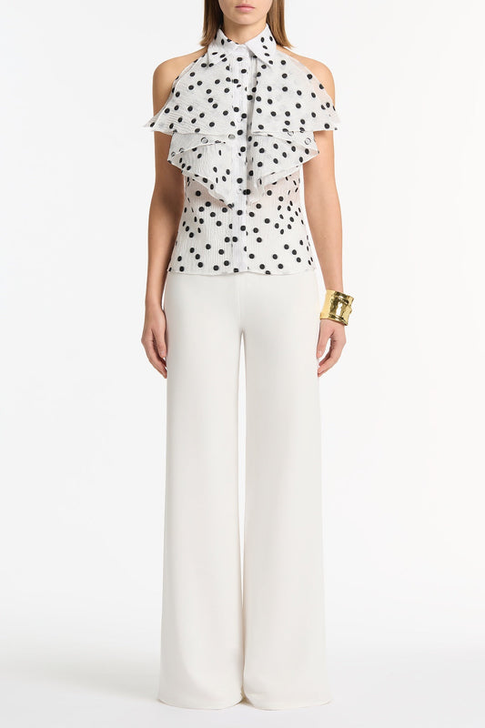 Image of a model wearing Pants. Product name - White Crepe Palazzo Pant in White colour by brand - Carla Zampatti