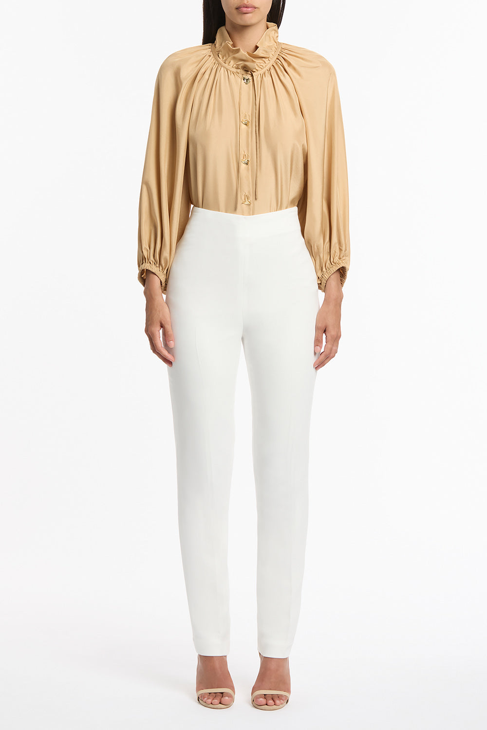 Image of a model wearing Pants. Product name - White Crepe Slim Pant in White colour by brand - Carla Zampatti