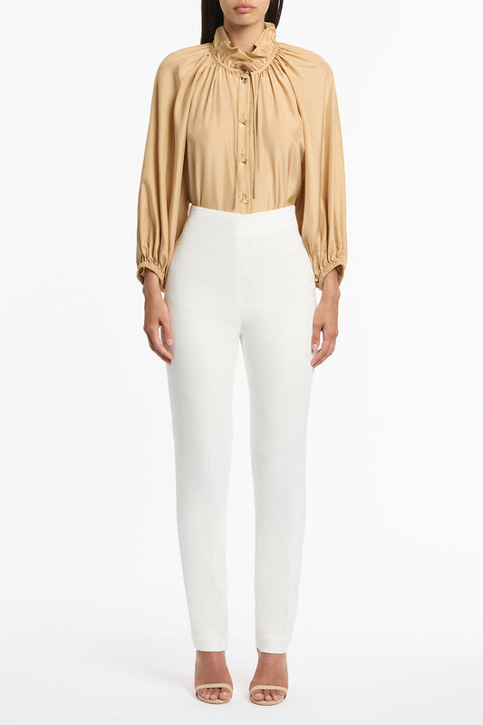 Image of a model wearing Pants. Product name - White Crepe Slim Pant in White colour by brand - Carla Zampatti