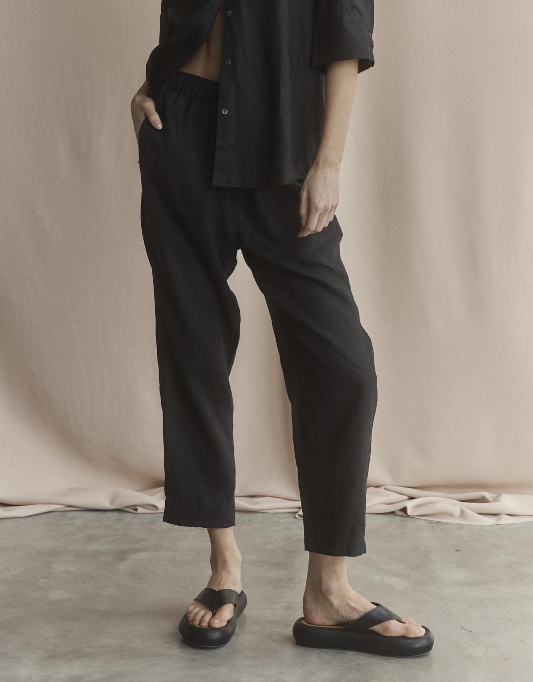 Image of a model wearing Pants. Productname: Abigail Linen Pant - in Black colour by brand - White by FTL