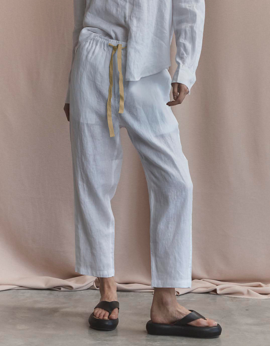 Image of a model wearing Pants. Productname: Abigail Linen Pant - in White colour by brand - White by FTL