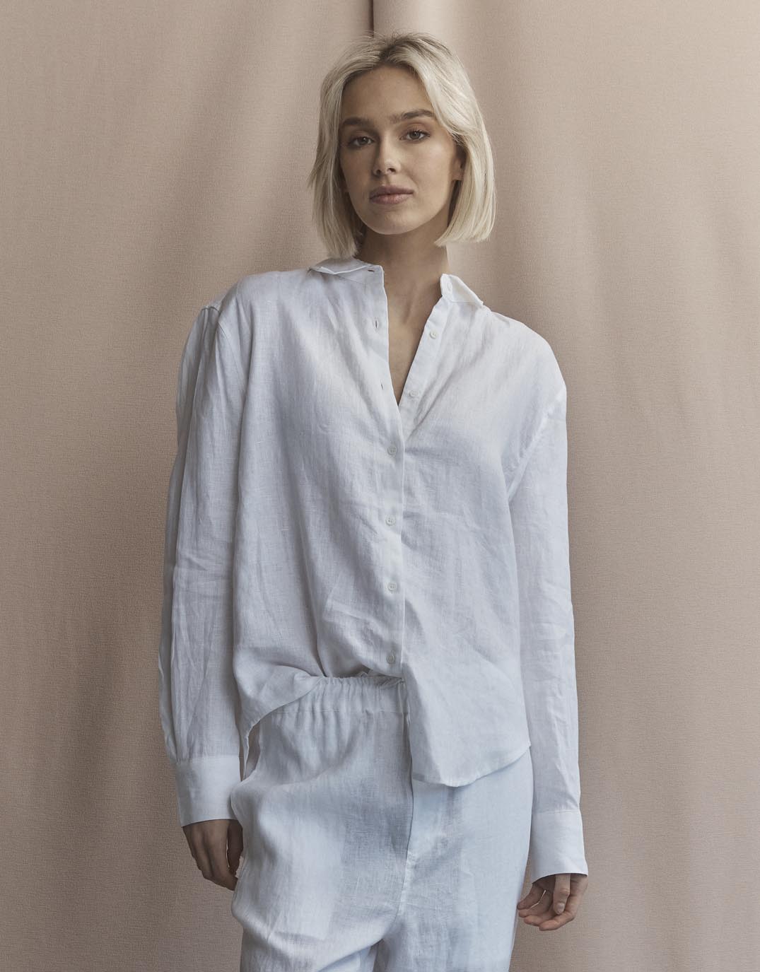 Image of a model wearing Tops. Productname: Katie Linen Shirt - in White colour by brand - White by FTL