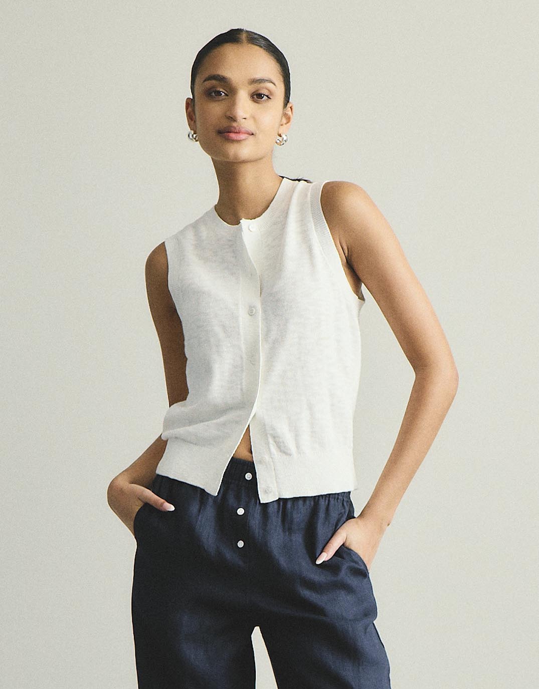 Image of a model wearing Tops. Productname: Kyra Button Tank - in White colour by brand - White by FTL